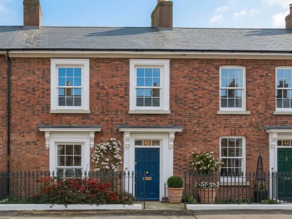 Brick terrace with freshly cleaned sash windows, frames and front door